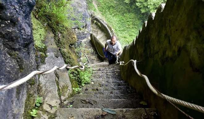 While planting the trees, Liu also fixed the path up to Tiantai Mountain. Photo: SCMP Pictures