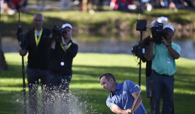 Sergio Garcia of Spain hits out of a bunker on the twelfth hole during the afternoon EPA/CRAIG LASSIG