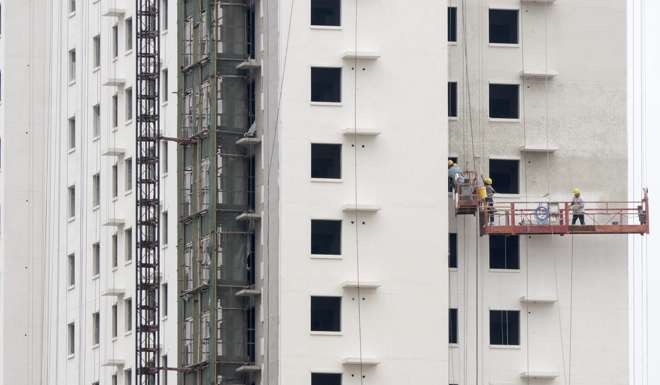 Housing construction in the suburbs of Beijing. Prices for new flats in the capital rose 25.8 per cent in August from a year earlier. Photo: EPA