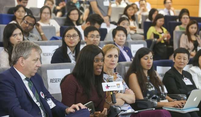 University of Hong Kong president Peter Mathieson, left, and Elizabeth Nyamayaro, second from left, head of the United Nations Woman’s HeForShe Initiative, attends at a brain storming session with students at the University of Hong Kong. Photo: Dickson Lee