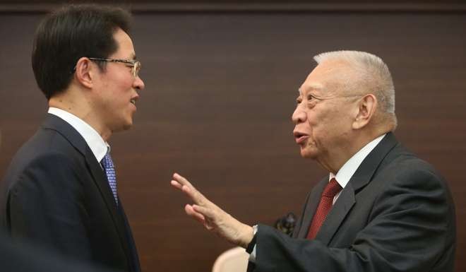 Former chief executive Tung Chee-hwa speaks to Zhang Xiaoming, director of the central government’s liaison office in Hong Kong, at a function this year. As chief executive, Tung was given a freer hand to appoint ministers. Photo: Edward Wong