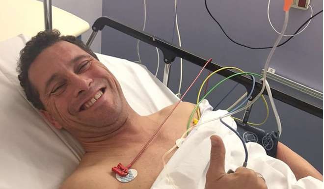 UKIP MEP Steven Woolfe gives a thumbs up from his hospital bed at Hospital De Hautepierr in Strasbourg, France. Photo: APs