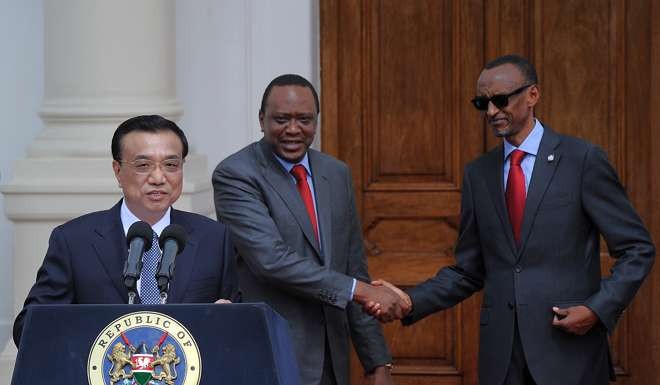 Chinese Premier Li Keqiang speaks as Kenya’s President Uhuru Kenyatta, centre, shakes hands with Rwanda’s President Paul Kagame in May 2014, during the signing ceremony of the Standard Gauge Railway agreement at the State House in Nairobi. Photo: AFP