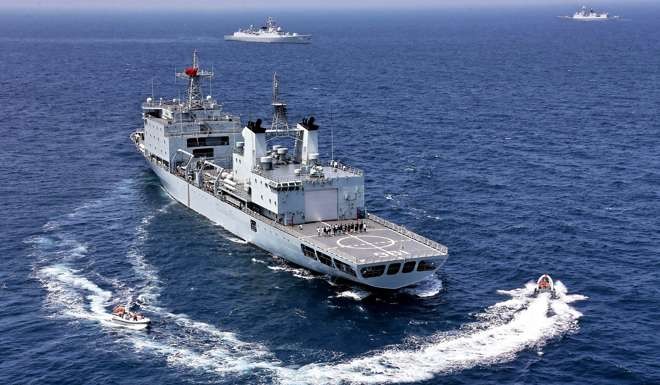 A Chinese Navy replenishment ship and destroyer take part in a joint naval drill last month with the Russian military in the South China Sea. Photo: Xinhua via AP