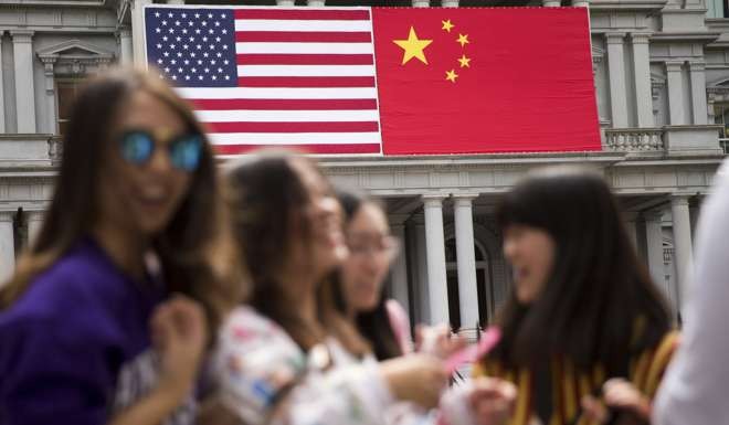 Chinese and US flags in Washington last year on the eve of President Xi Jinping’s state visit. Photo: AP