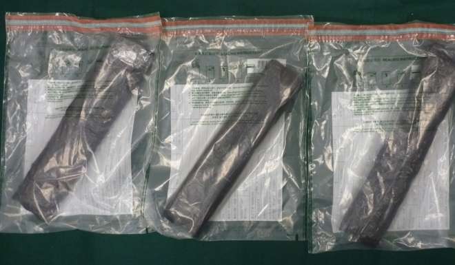 The suspected cocaine seized at Hong Kong airport on Friday was found in three slabs in a suitcase. Photo: SCMP Pictures