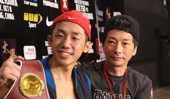 Rex Tso and manager Jay Lau in the post-bout interview.