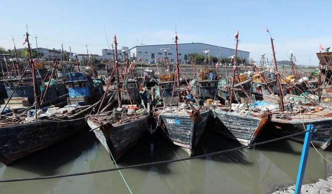 Several Chinese fishing boats that were caught while reportedly operating illegally in South Korea's exclusive zone are moored at a port in Incheon, South Korea. Photo: EPA/Yonhap