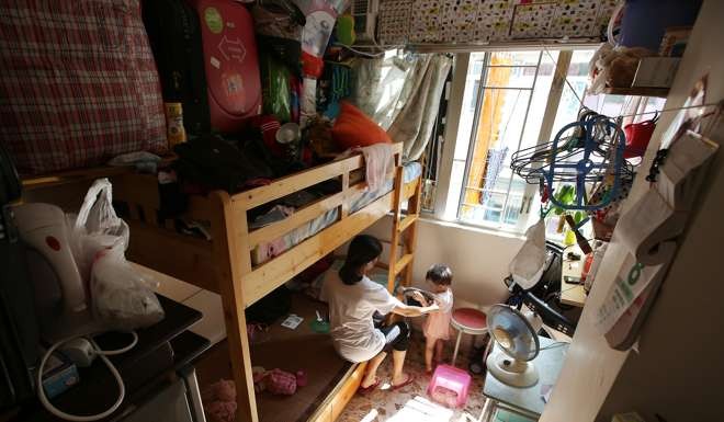 Residents of a subdivided flats in Sham Shui Po have their kitchen sharing the space in their bedrooms. Photo: Edward Wong