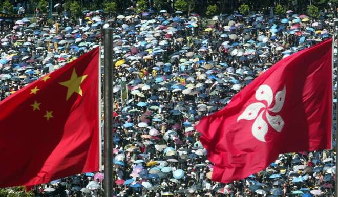 About 500,000 peole joined the SAR establishment day rally from Victoria Park to government headquarters in Central to protest against a security bill based on Article 23 of the Basic Law, on July 1, 2003. Photo: Martin Chan