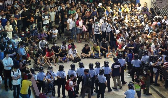 Young protesters stand their ground in Mong Kok during the Occupy movement, on October 17, 2014. Photo: K.Y. Cheng