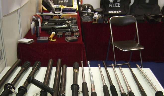 Batons including some with spikes, reportedly used for torture, are displayed at a police equipment exhibition at an undisclosed location in China. Photo: AP /Amnesty International