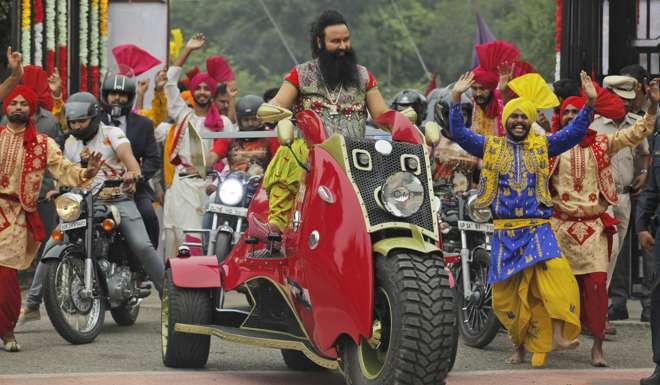 Saint Dr. Gurmeet Ram Rahim Singh Ji Insan arrives for a press conference ahead of the release of his new film. Photo: AP