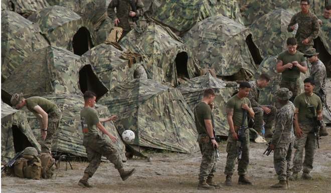 US marines wait to take part in a live-fire amphibious landing exercise this month in Capas township, Tarlac province, north of Manila, during a joint military drill with Philippine forces. Duterte has threatened to suspend the US-Philippine joint patrols and military exercises in the South China Sea. Photo: AP