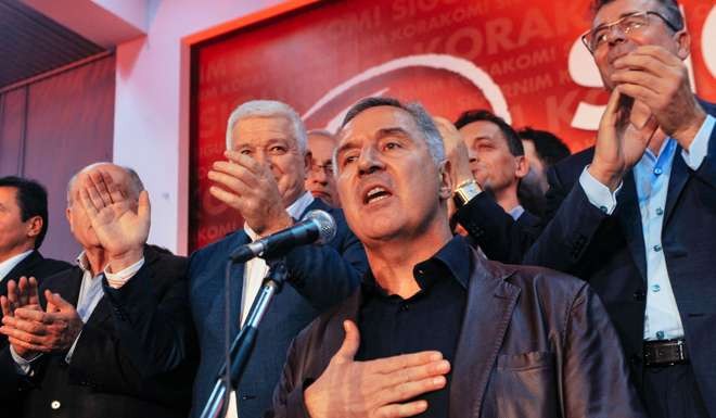Montenegrin Prime Minister Milo Djukanovic and leader of ruling Democratic Party of Socialists speaks to supporters after parliamentary elections in Podgorica. Photo: AFP