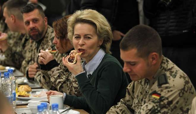German Defence Minister Ursula von der Leyen (C) has breakfast with German troops in Mazar-i-Sharif, Afghanistan. Photo: Reuters