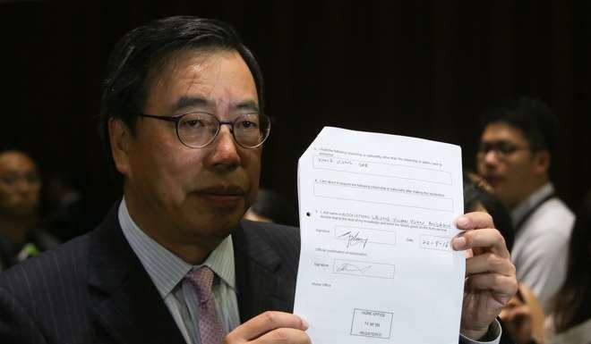 Andrew Leung presents the notice of his renunciation of his British nationality. Photo: Sam Tsang