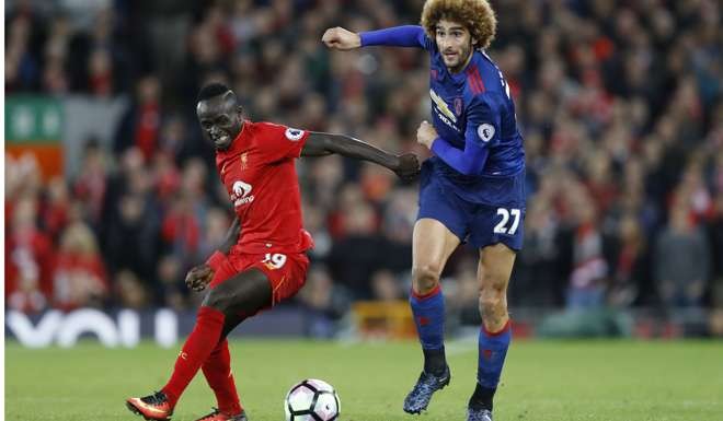 Liverpool's Sadio Mane in action with Manchester United's Marouane Fellaini Action Images via Reuters / Carl Recine