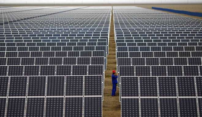 Solar panels at a massive farm in Dunhuang, in Gansu Province. Photo: Reuters