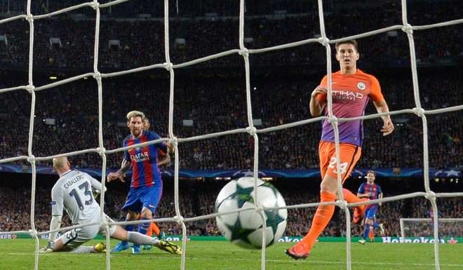 Barcelona's Argentinian forward Lionel Messi (2nd L) scores a goal beside Manchester City's defender John Stones (R) during the UEFA Champions League football match FC Barcelona vs Manchester City. Photo: AFP