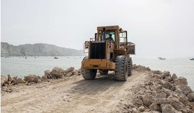 A bulldozer works on a development site in Gwadar in Balochistan, Pakistan, where Chinese money is helping to build a deep sea port that will be a key node on the Belt and Road project. Photo: Bloomberg