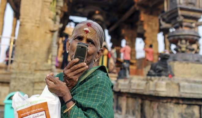 A devotee talks on her mobile phone outside a temple in Tamil Nadu, India. Could the Belt and Road initiative inspire China to make a concerted effort to understand India and other major civilisations around the world? Photo: Bloomberg