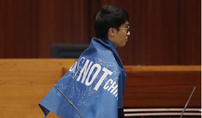 Legislator-elect Sixtus Leung, whose oath was invalidated, says his fight with the government is to safeguard Hong Kong people’s interests. Photo: AP