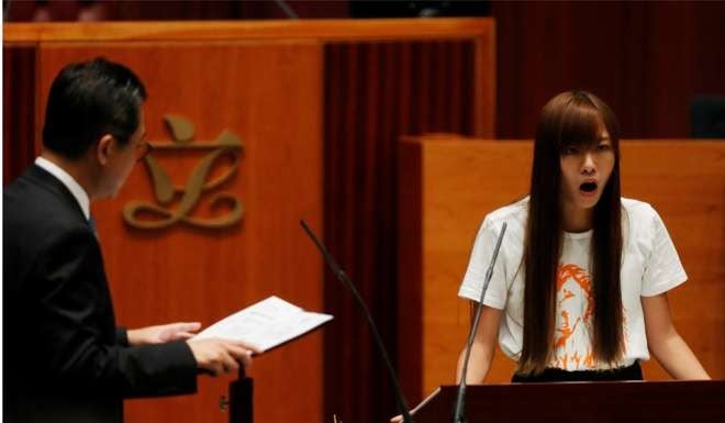 Lawmaker-elect Yau Wai-ching took her oath last week, which was invalidated. Photo: Reuters