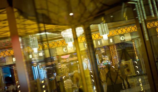 Tourists visit the casino at Studio City Macau. Photo: AFP