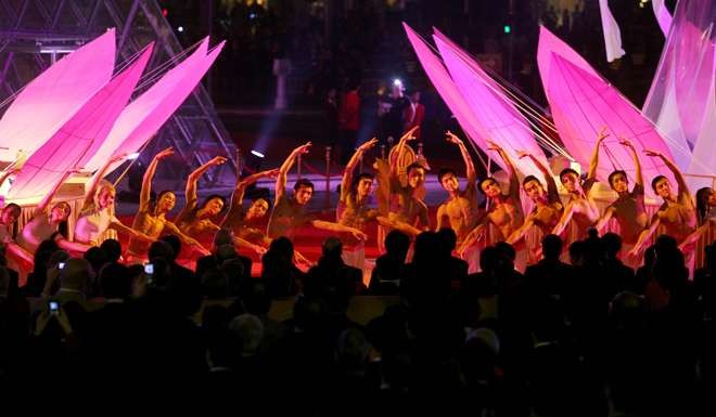 Dancers line up in front of VIP guests at the Grand Lisboa casino in Macau. Photo: AFP