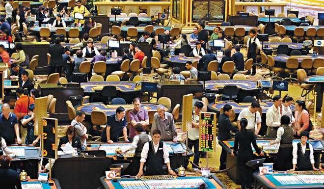 Tourists gamble at a casino in Macau. Photo: AFP