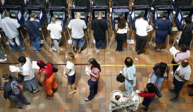 Voters stand in line in Miami-Dade County, Florida, to vote in the US presidential election on November 2, 2004, which saw incumbent George W. Bush defeat Democratic nominee John Kerry. Photo: Reuters