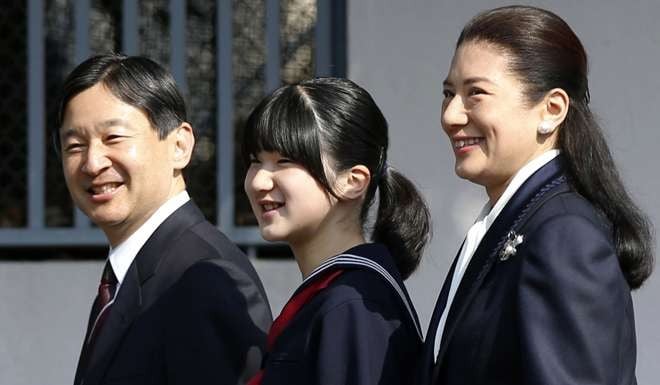 Japan's Princess Aiko, centre, accompanied by her parents Crown Prince Naruhito and Crown Princess Masako, attends her graduation ceremony at the Gakushuin Primary School in Tokyo in 2014. File photo: AP