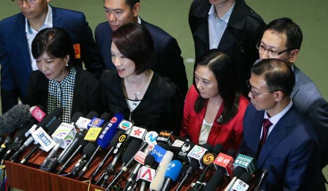 Pro-Beijing legislators address the press inside the complex at Admiralty. Photo: Dickson Lee