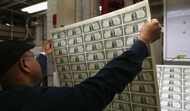 Newly printed sheets of one dollar bills at the Bureau of Engraving and Printing in Washington, DC. Photo: AFP