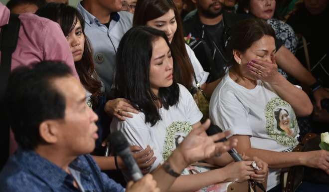 The parents and twin sister of Salihin, who was murdered by Jessica Kumala Wongso, react as judges give their verdicts. Photo: AFP