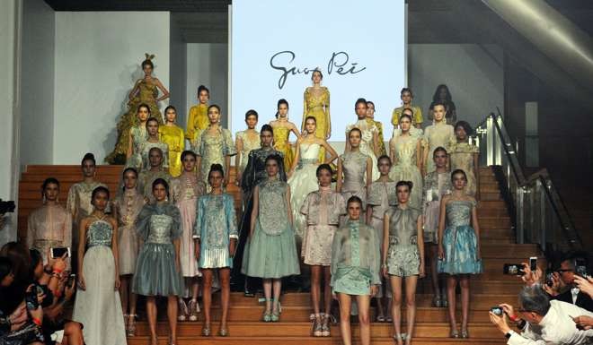 Models show looks from Guo Pei’s show at the National Gallery Singapore. Photo: Xinhua