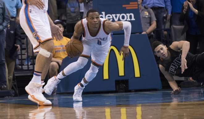 Russell Westbrook #0 of the Oklahoma City Thunder watches the time clock as he looks for a play against the Phoenix Suns during the overtime period AFP