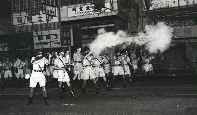Riot police shoot tear gas in North Point during the trouble in July 1967. Photo: SCMP Pictures