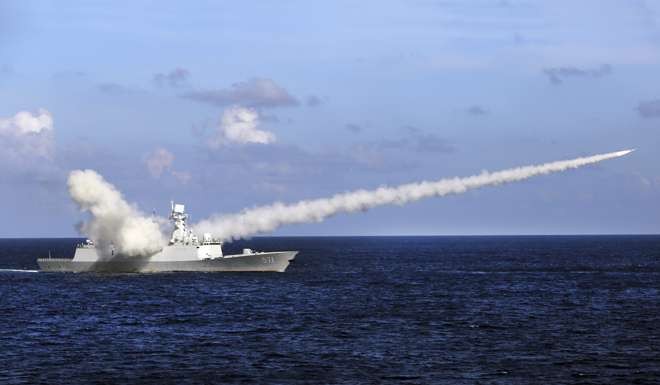 The Chinese missile frigate Yuncheng launches an anti-ship missile during a military exercise in the South China Sea in July. Photo: Xinhua