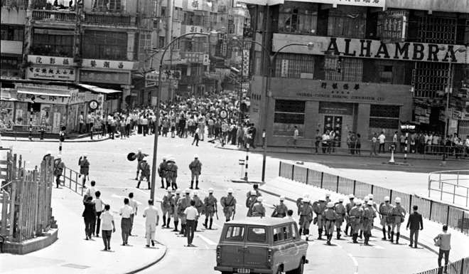 A mob at the junction of Nathan Road and Kansu Street in Yau Ma Tei flees as the Police Riot Squad advances down Gascoigne Road, in May 1967. Photo: SCMP Pictures