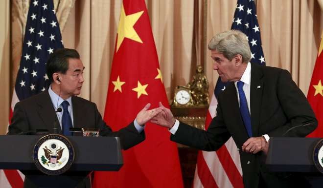 Foreign Minister Wang Yi and US Secretary of State John Kerry at a joint news conference after their meeting in Washington on February 23. Photo: Reuters