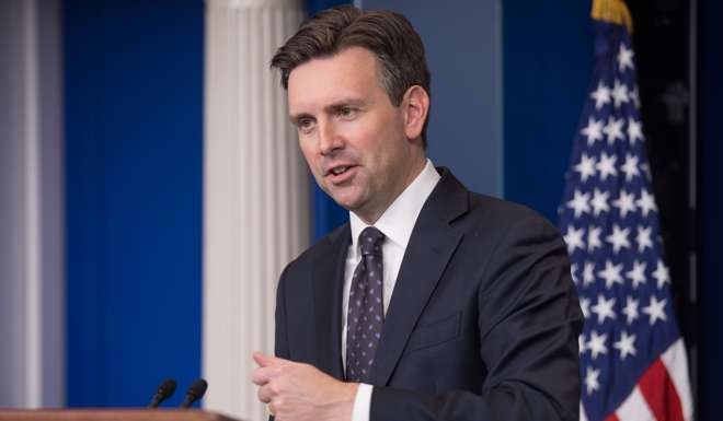 White House spokesman Josh Earnest speaks at the daily press briefing at the White House in reacting to FBI Director James Comey's bombshell decision to announce further investigation of Hillary Clinton's email. Photo: AFP