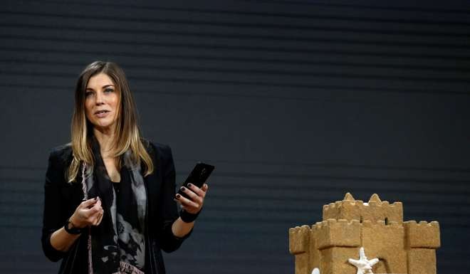 Megan Saunders, Microsoft general manager of HoloLens and other emergent technologies, uses a mobile phone to scan a sand castle object into Microsoft's new Paint 3D. Photo: Reuters