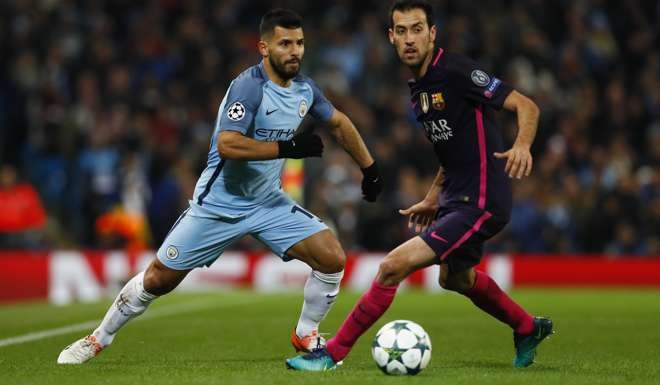 Manchester City's Sergio Aguero in action against Barcelona's Sergio Busquets Action Images via Reuters / Jason Cairnduff