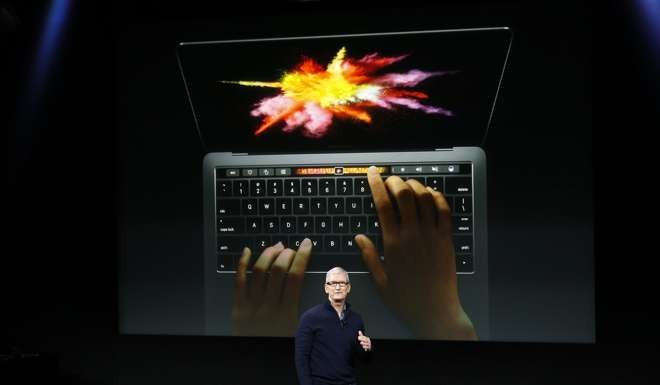 Tim Cook, CEO of Apple, introduces the updated Apple Macbook Pro line. Photo: EPA