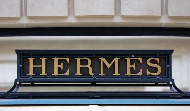 A Hermes sign is seen on one of their stores in Paris, France. Photo: Reuters