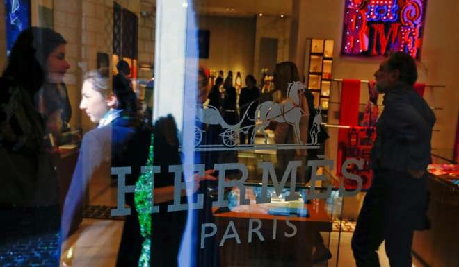 People are seen inside the new Hermes boutique in Rome, Italy. Photo: Reuters