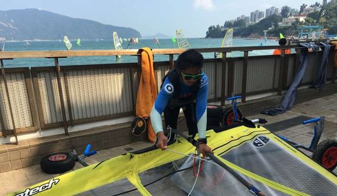Mak Cheuk-wing packs her board. Photo: Chan Kin-wa