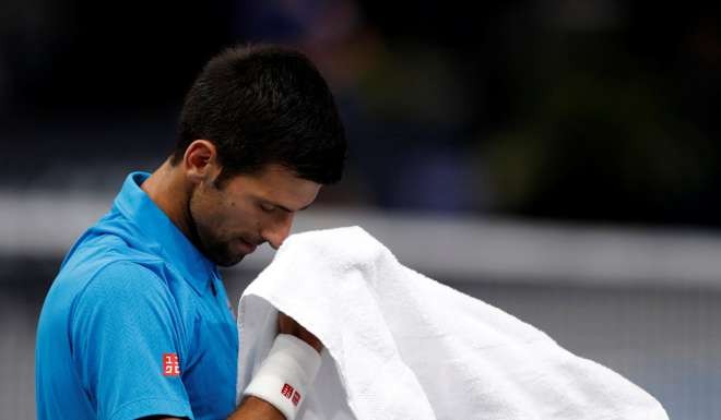 Novak Djokovic of Serbia v Marin Cilic of Croatia - Paris, France - 4/11/2016 - Djokovic reacts at the end of the match. REUTERS/Gonzalo Fuentes